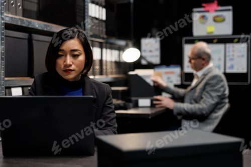 Preview: Business workers checking invoice