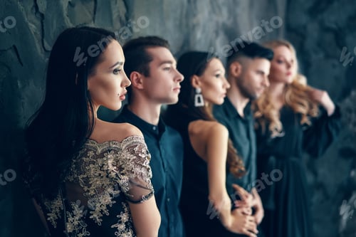 Preview: Group of young beautiful people posing in studio