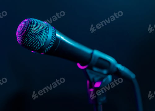 Preview: Microphone on black background with colorful pink and turquoise light. Music, concert concept.
