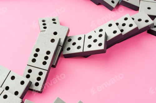 Preview: Domino tiles on pink background studio shot