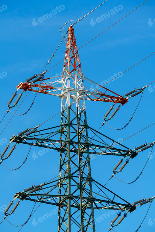 Preview: High voltage tower with electricity transmission power lines against blue sky