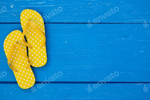 Preview: Beach flip-flops on blue wooden background