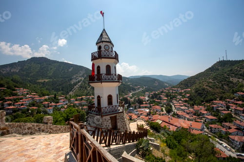 Preview: The Victory Tower (Zafer Kulesi) with the traditional houses in the background. Goynuk, Bolu, Turkey