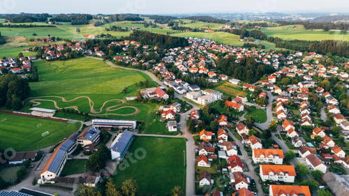 Preview: Aerial view of agricultural fields and a small town