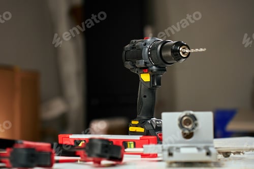 Preview: Cordless drill and tools in home renovation workshop