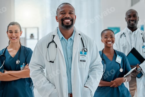 Preview: Group of happy diverse doctors standing together while working at a hospital. Content expert medica