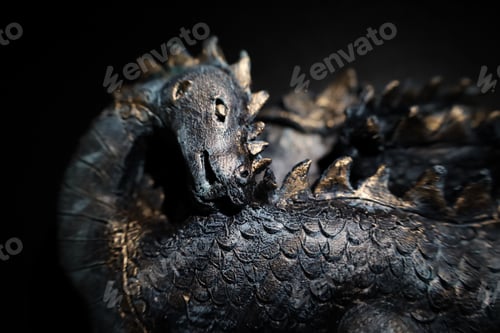 Preview: a close up image of a dragon statue with gold detailing