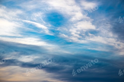 Preview: Sunset sky. Abstract nature background. Dramatic blue and orange, colorful clouds at twilight time.