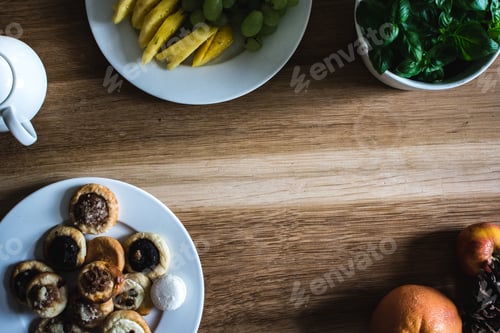 Preview: Homemade pastries and fruits on table