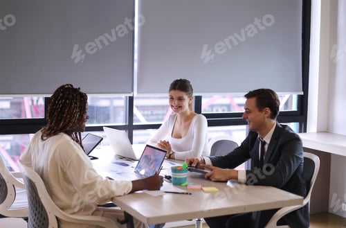 Preview: Shot of a group of businesspeople in a meeting at work
