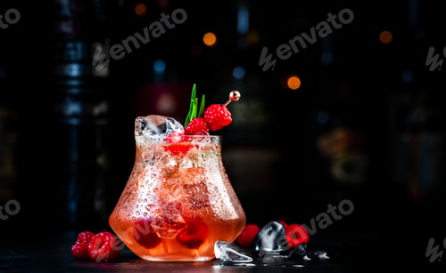Preview: Pink rum - cocktail drink with white rum, pineapple juice, cranberries, raspberries, rosemary