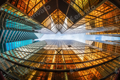 Preview: Uprisen angle of Hong Kong skyscraper with reflection of clouds among high building