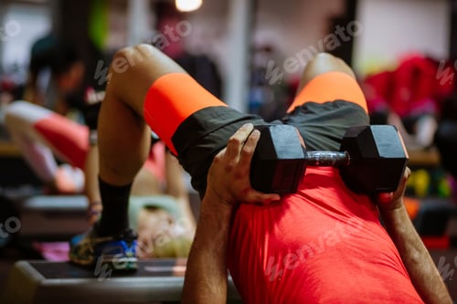 Preview: Man Lifting Weights During an Exercise Session