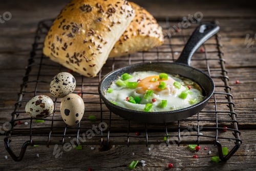 Preview: Homemade fried eggs with bun and chive for breakfast