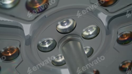 Preview: Modern cosmetology clinic lamp operating by unknown medical worker close up