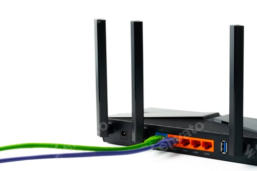 Preview: Modern router with cables plugged in close up