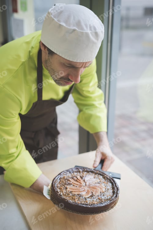 Preview: Waiter placing tart on table