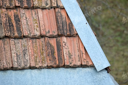 Preview: Closeup surface of old weathered ceramic tiles covering building roof