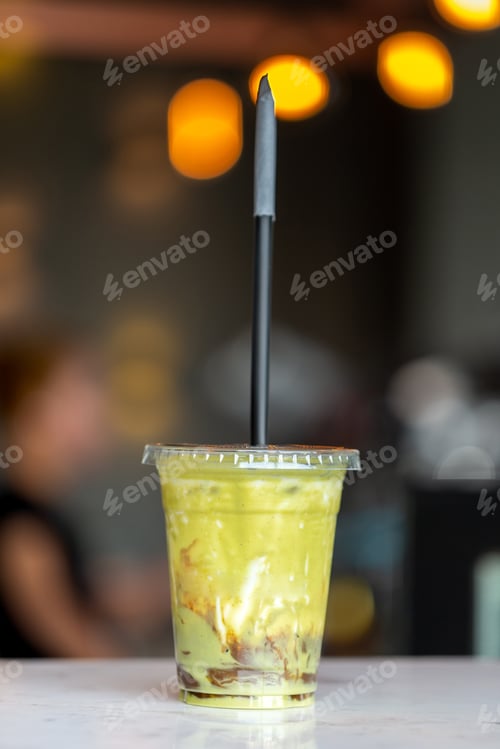 Preview: Freshly made delicious avocado juice with honey. Healthy cold beverage at the cafe.