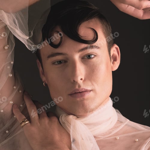 Preview: Portrait, non binary fashion and vintageaesthetic with designer clothing and beauty in studio. Isol
