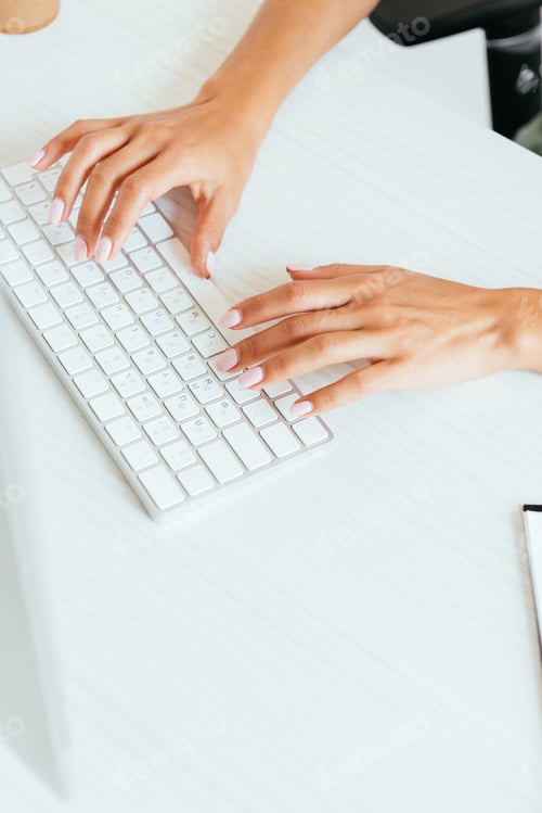 Preview: cropped view of woman typing on computer keyboard in office