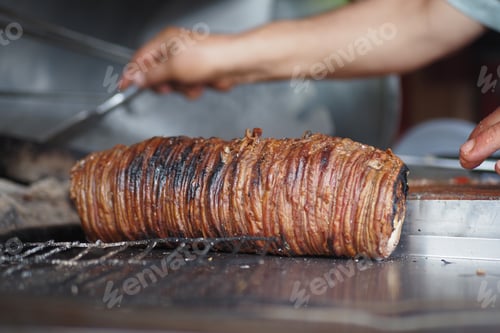 Preview: Turkish Street Food Kokorec made with sheep bowel cooked in wood fired oven.