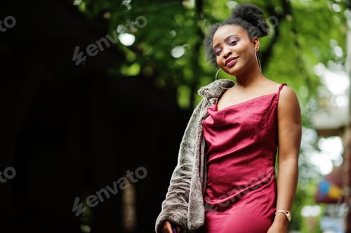 Preview: Black model in red silk dress.