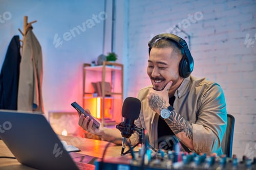 Preview: Smiling Podcast Host in His Studio at Night