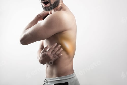 Preview: man showing his lats muscle soreness