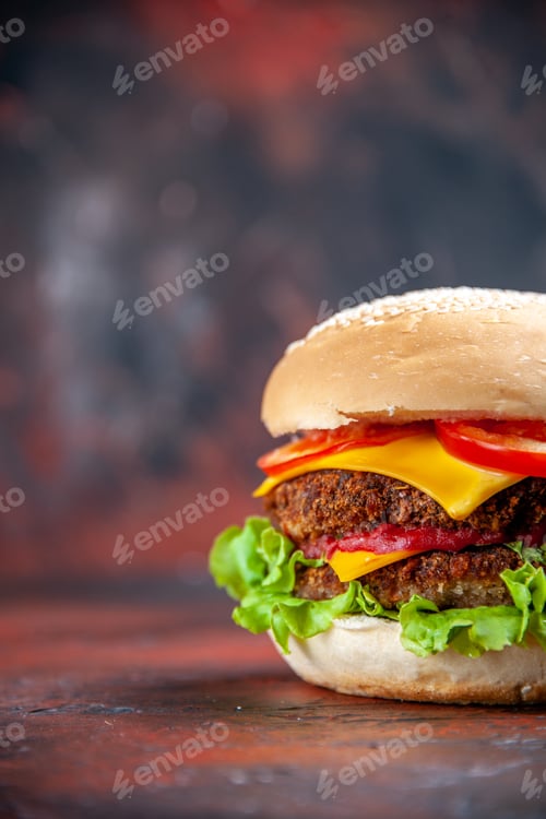 Preview: front view tasty meat burger with cheese and salad on the dark background bun sandwich fast-food