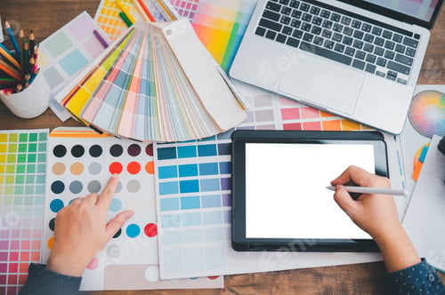 Preview: Graphic designer architects who work with laptops and color comparison tables for design work.