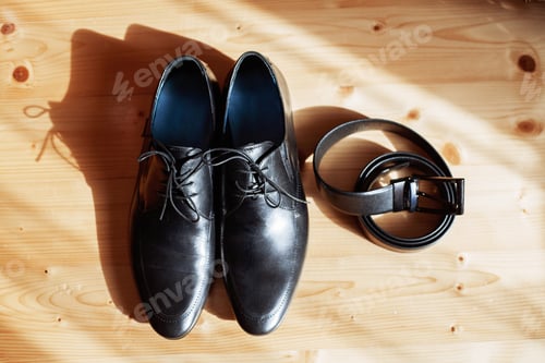 Preview: Men's shoes and belt on the floor. The concept of fashion and we
