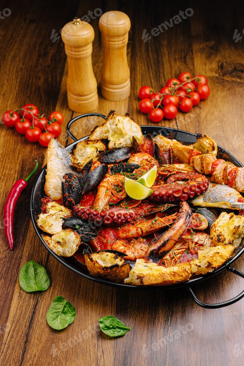 Preview: Fresh seafood feast featuring octopus, shrimp, and vegetables on wooden table