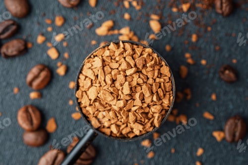 Preview: Instant coffee granules in scoop with coffee beans