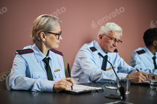 Preview: Middle Aged Caucasian Woman and Senior Caucasian Man Attending Political Meeting