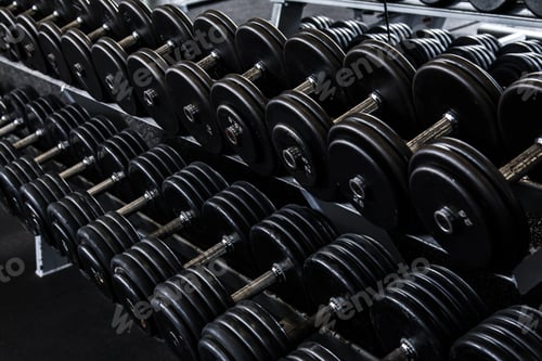 Preview: Different black dumbbells in the modern gym