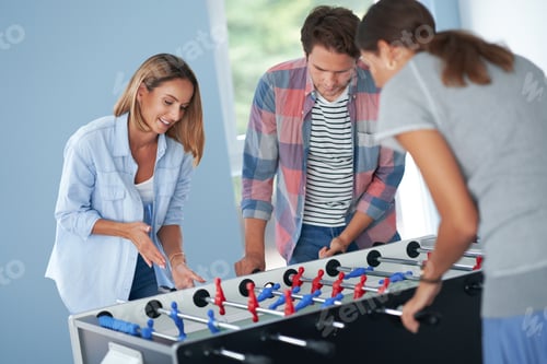 Preview: Group of students playing table soccer in the campus