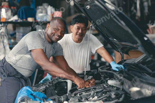 Preview: happy auto mechanics service team staff worker enjoy working together portrait happy smiling