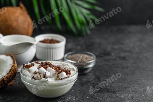 Preview: Coconut pudding with granola and chia seeds. Healthy superfood, copy space