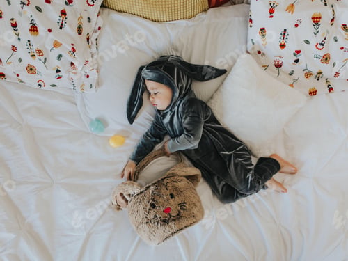 Preview: Child Dressed as Bunny Sleeping with Easter Eggs