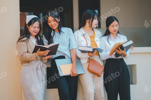 Preview: group of students young university students consulting doing homework