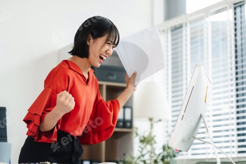 Preview: Successful business woman, excited young woman Keeping up arms and showing positive emotions