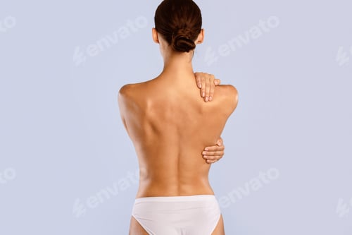 Preview: Young woman taking care of her spine