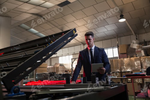 Preview: Elegant man inspecting work of factory