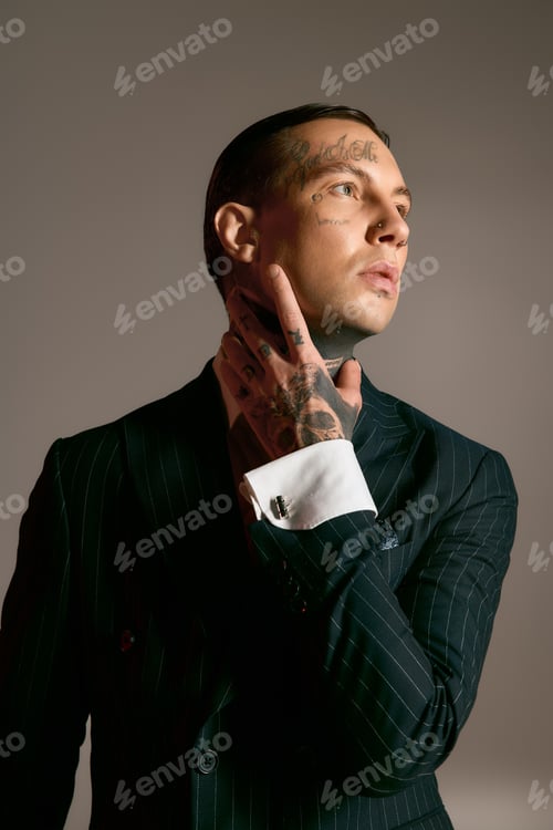 Preview: Stylish man in a sleek suit poses confidently against a serene backdrop