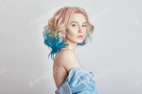 Preview: Portrait woman with bright colored flying hair, all shades of purple blue. Hair coloring