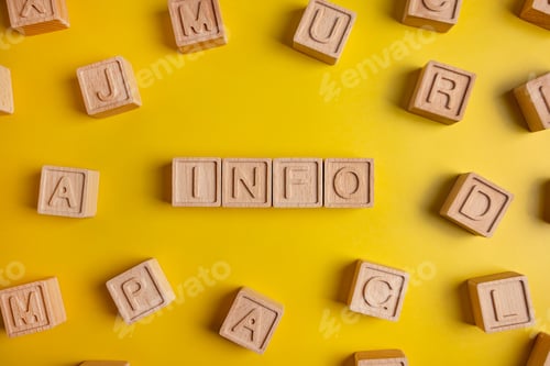Preview: Word info is written on a wooden cubes structure. Blocks on colorful background. Selective focus.