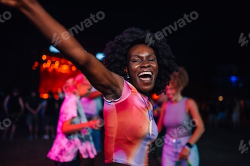 Preview: Joyful celebration at a nighttime music festival