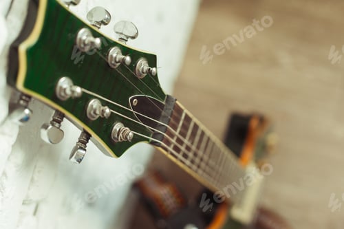 Preview: Electric guitar body and neck detail on wooden background