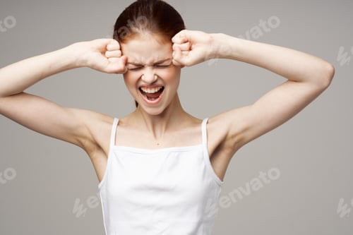 Preview: woman depression symptoms headache light background